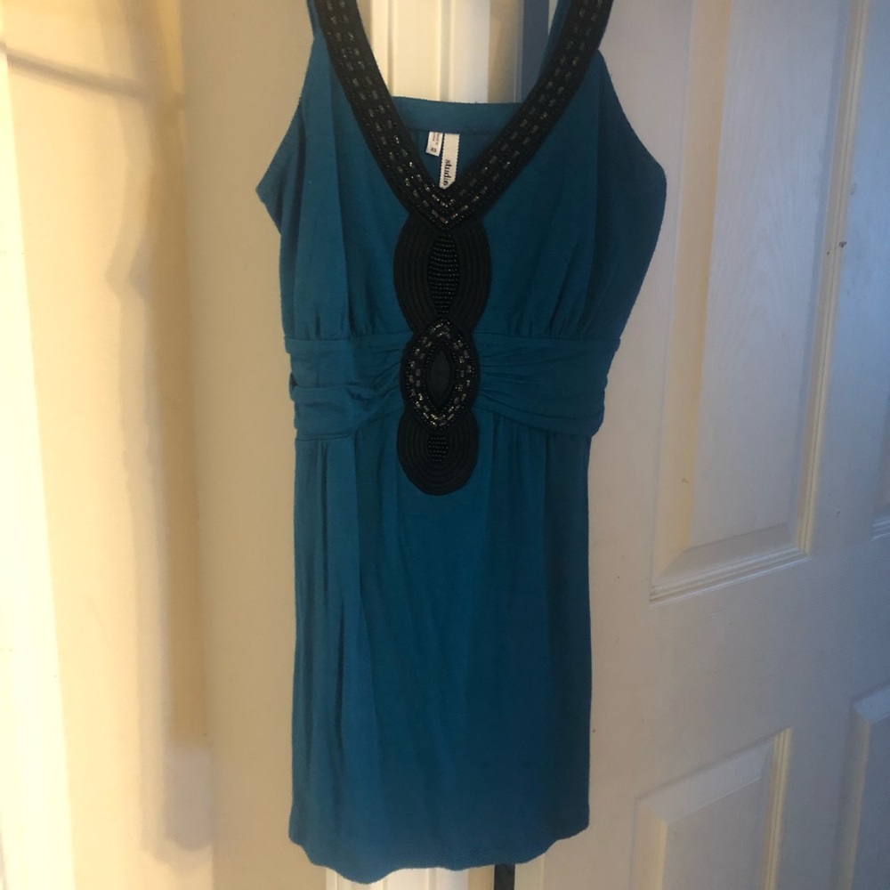Turquoise shirt with black trim